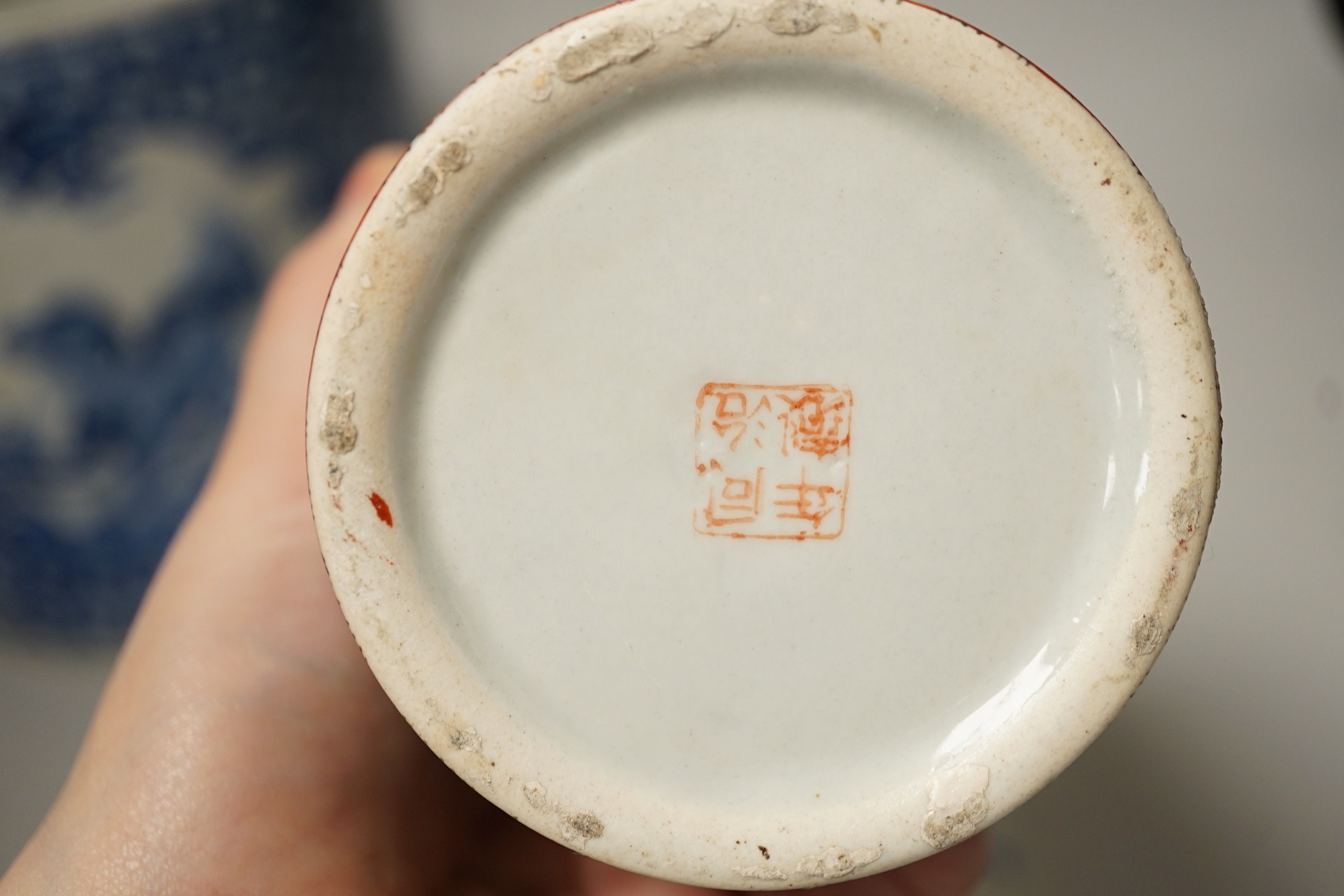 A Chinese blue and white brushpot, enamelled jar, brush pot, famille verte jar cover and a Japanese blue and white tea bowl and cover. Tallest 18cm